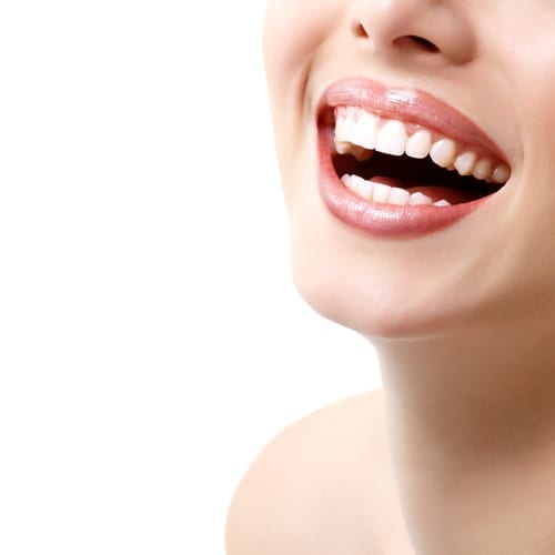 Close up of a woman smiling with her mouth open