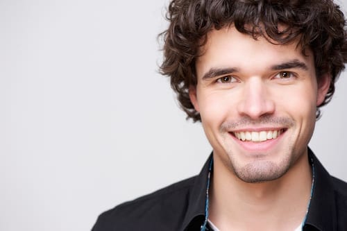 Headshot of a smiling male model