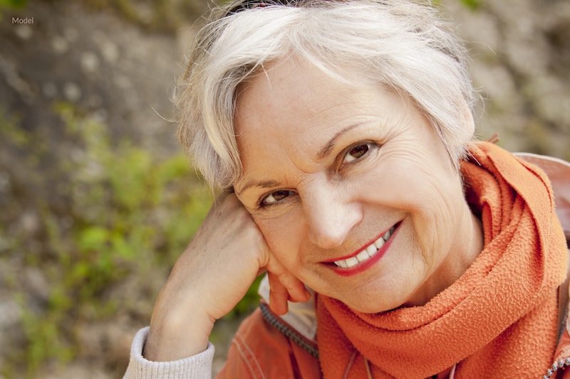 Woman smiling with full set of teeth. 